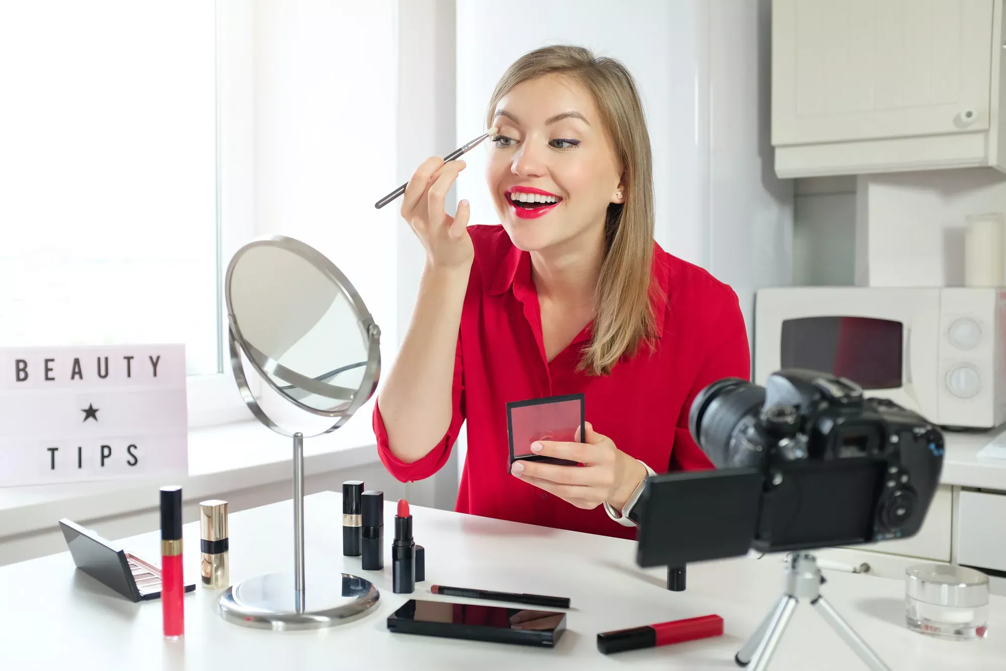 stylish-young-woman-blogger-recording-make-up-video-guide-on-beauty-tips